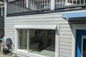 DOORBRIM rain drip guard over double bay window.