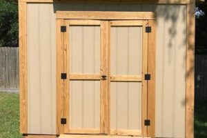 DOORBRIM rain diverter mounted above shed doors to stop a leak.