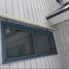 DOORBRIM rain guard mounted above an exterior window to stop leaking.