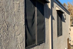 DOORBRIM rain guard mounted above an exterior window.