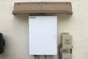Rain diverter over pool electrical equipment.