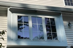 DOORBRIM rain guard mounted above an exterior window.