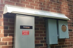 DOORBRIM rain diverter installed above Generac GENERATOR electrical equipment..